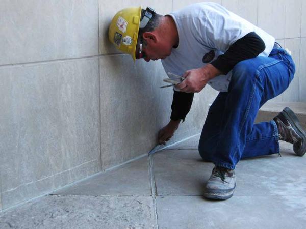 Crew Caulking the Floor