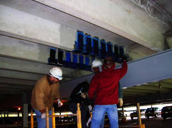 Crew Working on Carbon Fiber Strengthening
