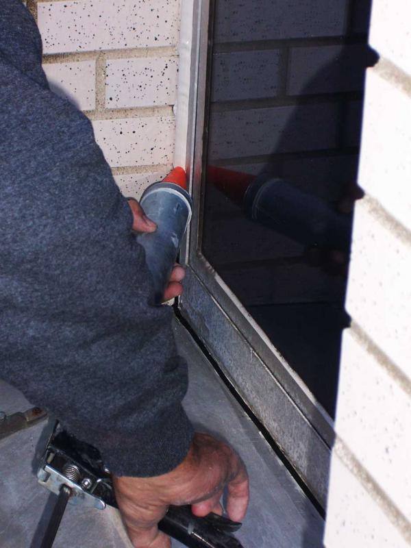 Crewing Caulking a Window