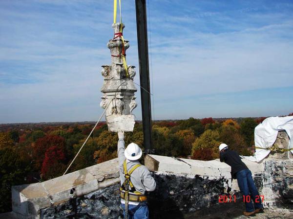 Crew Members Repairing a Stone Building