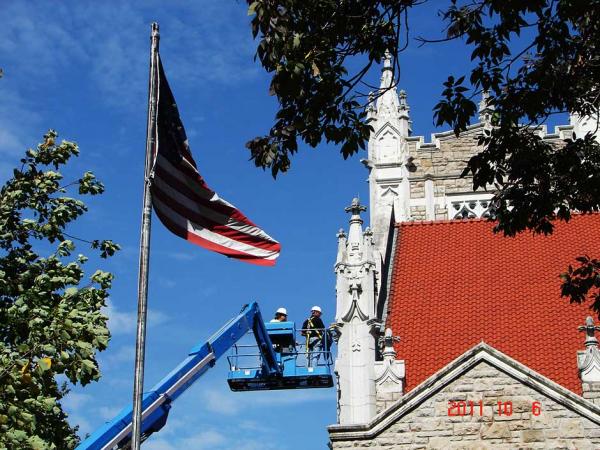 Crew Members Repairing a Building